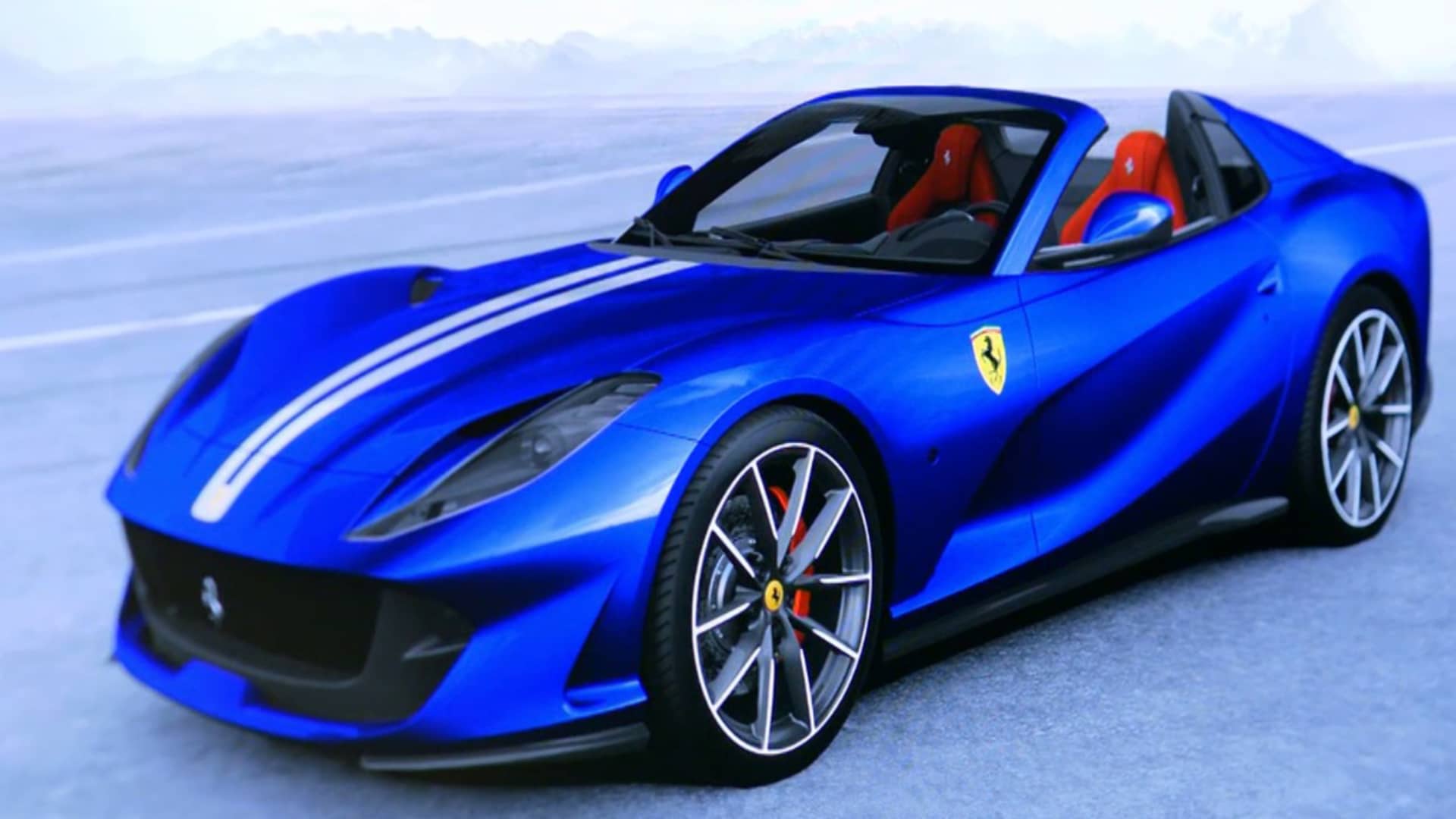 Ferrari Tailor-Made 纽约展厅内部，客户在选材桌前与设计师讨论皮革和漆色方案