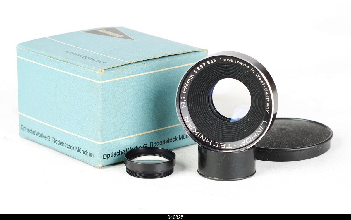 Linhof 牌 Rodenstock 镜头和蓝色包装盒，展示镜头筛选制度下完整的品牌化商品形态